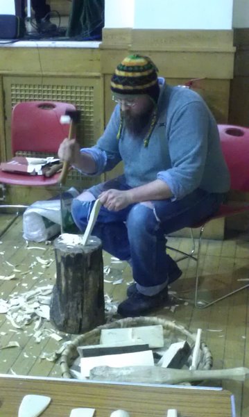 Handcrafting a wooden spoon.